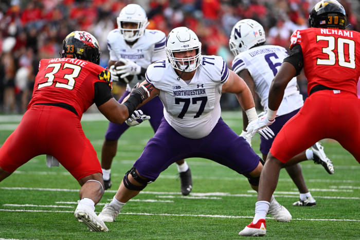 Northwestern Wildcats offensive lineman Peter Skoronski (77) prepares to block against the Maryland Terrapins at SECU Stadium.